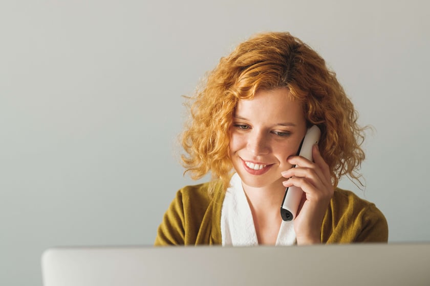 Businesswoman Speaking On The Phone At The Office Businesswoman Speaking On The Phone At The Office