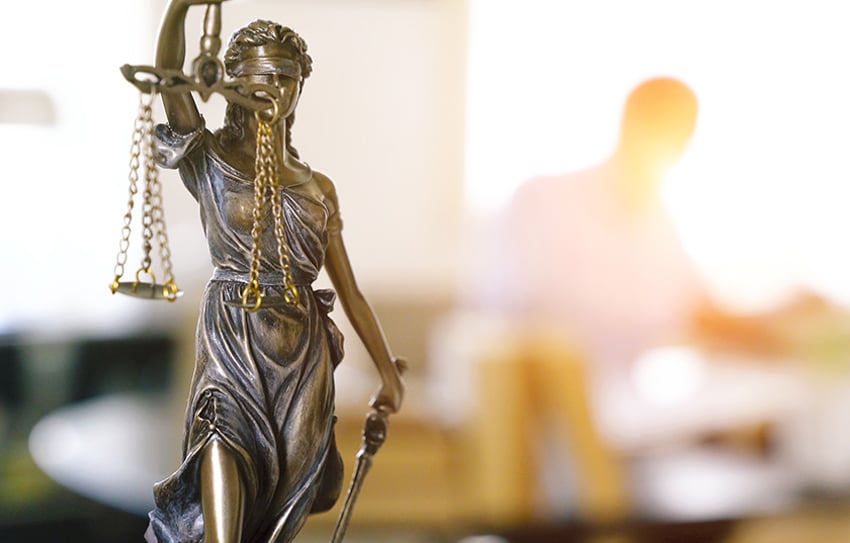 The Statue of Justice - lady justice or Iustitia / Justitia the Roman goddess of Justice in lawyer office